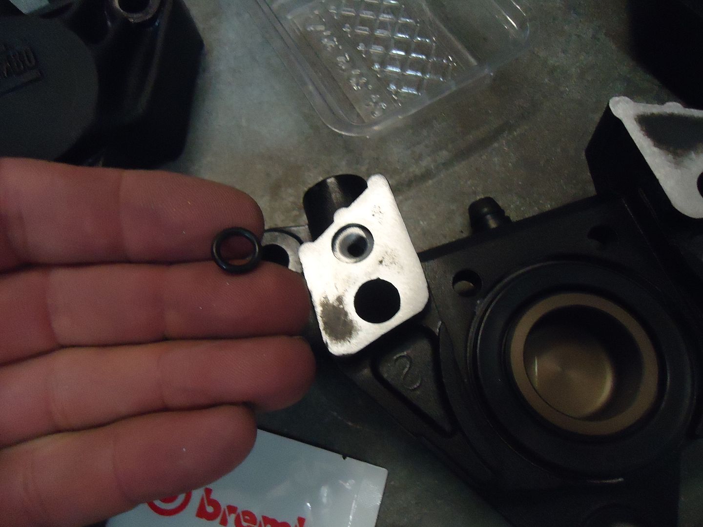 Brembo P08 caliper leak...a question (more leaks!).
